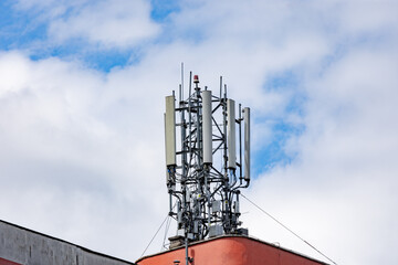 Close up to a 5g antenna for a faster network signal and data transfer, against cloudy sky