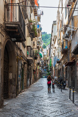 View of typical narrow street at Toledo neighborhood in Naples, Italy - obrazy, fototapety, plakaty