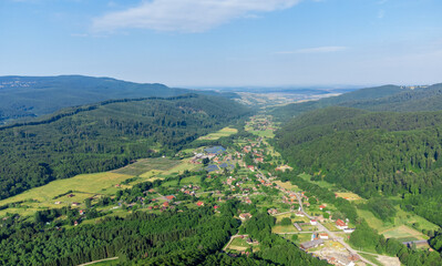 Fototapeta na wymiar aerial landscape of a village between hills