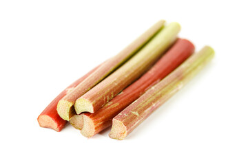 Ripe rhubarb stalks on white background, selective focus.