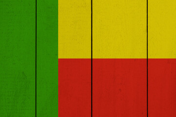 Patriotic wooden plank background in colors of flag. Benin