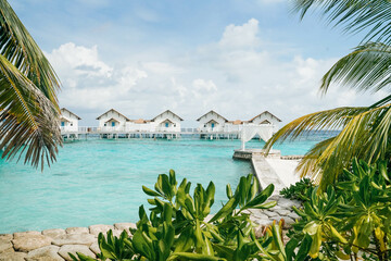 White arch with Beautiful Landscape of Tropical beach summer at resort hotel and spa, Maldives...