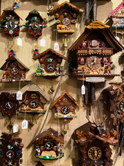 Rothenburg ob der Tauber, Bavaria, Germany - December 8, 2021: Vintage cuckoo clocks on the wall.