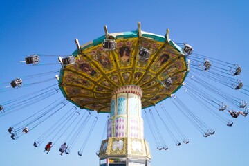 Volgograd, Russian Federation, June 19, 2022 - Swing carousel in an amusement park on the Volga...