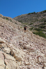 Hiking over stony trails on Krk island, Croatia