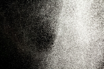 Sprayed water. Small droplets of water in the air. Lots of water drops, isolated on black...