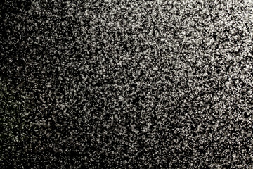 Fototapeta premium Sprayed water. Small droplets of water in the air. Lots of water drops, isolated on black background.