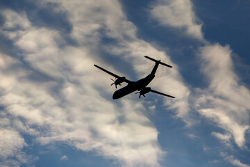Turboprop air plane with propellers flying in the sky.