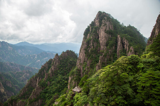 Peaks of the Huangshan Mountain, with a pavilion at the bottom.
