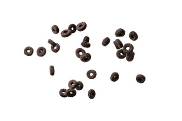 Chocolate rings cereal spill out into a bowl. Breakfast.