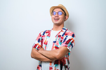 Young handsome man happy face smiling with crossed arms looking at the camera. positive person.