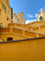 The Basilica of Saint-Michael the Archangel in Menton, France. The tall bell tower on the right...