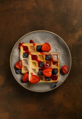beautiful waffles on a dark background in a plate