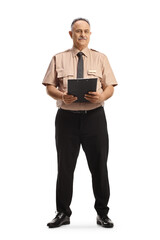 Full length portrait of a mature security guard holding a clipboard and looking at camera