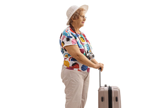 Elderly female tourist with a suitcase