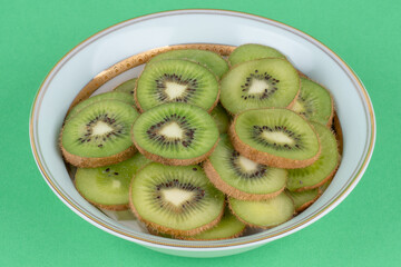 kiwi fruit on green background
