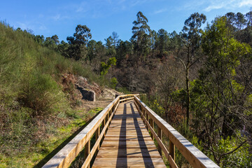The river hiking trail Ecovia do Vez near Arcos de Valdevez, Portugal. Ecovia do Vez wooden pathways along the riverside.