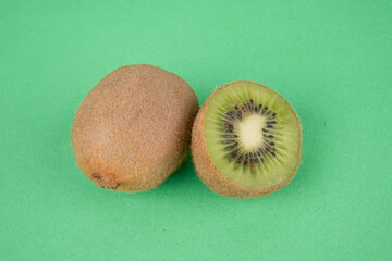 kiwi fruit on green background