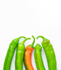 A group of delicious red and green hot and tasty peppers with copy space isolated with clipping path on a white background. Spicy ingredients and flavoring