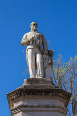 Fototapeta na wymiar Santo Tirso, Portugal - April 3, 2022: The Sao Bento Square at the city centre of Santo Tirso. The Sao Bento Count statue.