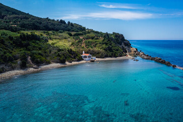 Aerial view of beach with Chapel of St Nikola near Skala and Paramonas villages, Corfu Island, Greece