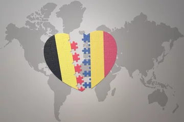 Foto op Plexiglas puzzle heart with the national flag of belgium and romania on a world map background.Concept. © luzitanija