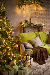 Christmas living room interior in studio apartment. Large decorated Christmas tree, sofa, plaid, gift boxes, fluffy carpet, light garlands.