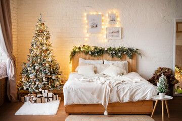 Decorated Christmas bedroom with Christmas tree and gifts. Light Scandinavian interior. Cozy bed in a chalet.