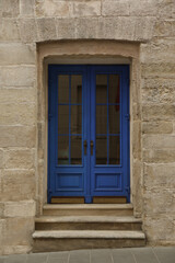 Fototapeta na wymiar View of building with blue wooden door. Exterior design