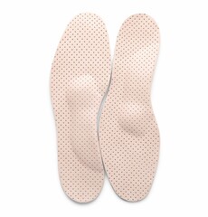 Beige orthopedic insoles isolated on white, top view