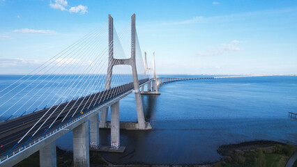 Lisboa, Portugal, April 24, 2022: Aerial view of the Vasco da Gama Bridge is a cable-stayed bridge...