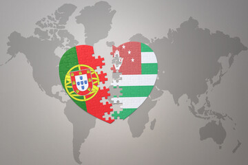 puzzle heart with the national flag of portugal and abkhazia on a world map background.Concept.