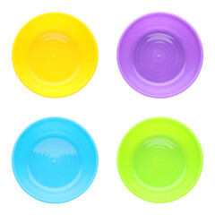 Set with colorful plastic plates on white background, top view. Serving baby food