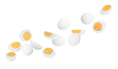 Tasty hard boiled eggs falling on white background