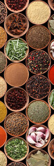 Collection of different aromatic spices and herbs on black background, flat lay. Vertical banner design