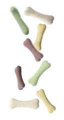 Bone shaped cookies for dogs falling on white background