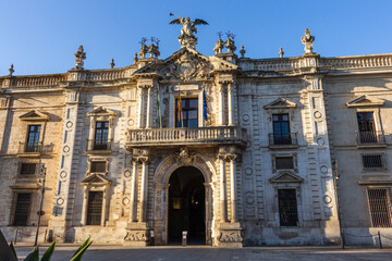 Fototapeta na wymiar Seville, Spain, September 11, 2021: The facade of the former Royal Tobacco Factory (Real Fábrica de Tabacos de Sevilla) is now the University of Seville (Universidad de Sevilla).
