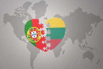 puzzle heart with the national flag of portugal and lithuania on a world map background.Concept.