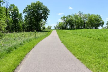 Fototapeta na wymiar The empty walkway in the park on a sunny day.