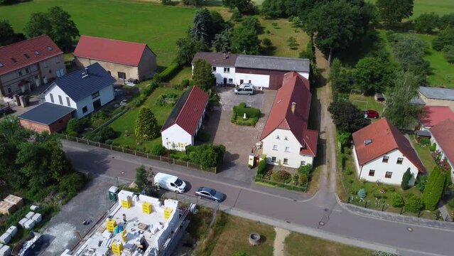 Vacations in the country
Wonderful aerial view panorama curve flight drone footage at Countryside village Hainichen in Europe Saxony Anhalt, summer 2022. 4k Cinematic from above by Philipp Marnitz