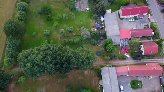 Large land plots in a small village.
Amazing aerial view flight tilt up drone footage
at Countryside Hainichen in Europe Saxony Anhalt, summer 2022. 4k Cinematic view from above by Philipp Marnitz