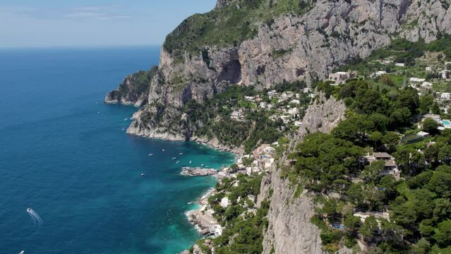 Dramatic Cliffs on Beautiful Coast of Capri Island, Italy - Aerial Establishing View