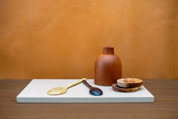 kitchen objects are arranged on the table with conceptual art. abstract compositions for decorating the living room or kitchen table. minimalist wood cooking tools