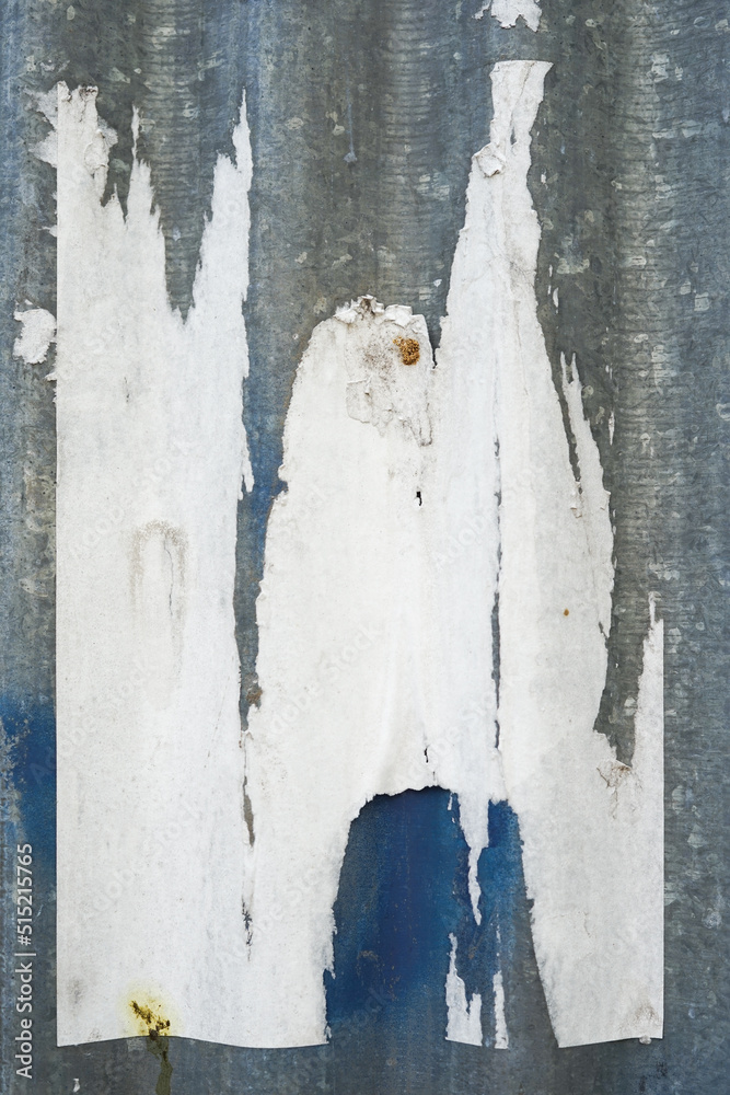 Poster abstract torn paper poster on the wall for background texture. the rough pattern of the street art m