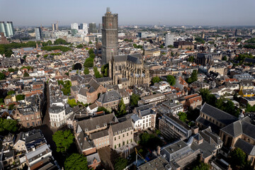 Aerial view medieval Dutch city centre of Utrecht with cathedral towering over the city lit up by early morning sunlight. Cityscape urban area in The Netherlands