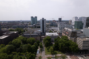 Aerial view of financial district and central train station area with modern architecture and historic office buildings in city center of Dutch urban Utrecht in The Netherlands