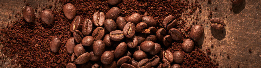 Roasted coffee beans different sort ground and whole isolated close up on brown grunge background