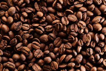Roasted coffee beans macro close up background