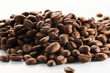 Roasted coffee beans isolated close up on white background, clipping path