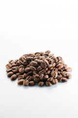 Roasted coffee beans isolated close up on white background, clipping path